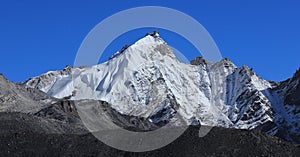 Azure blue sky over a mountain seen from Gorakshep