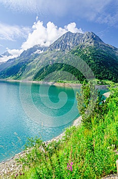 Azure mountain lake and high Alpine peaks, Austria