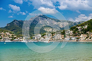 Azure sea with mountains on a background in the small coastal town Port de Soller