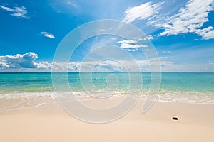 azure sea water, fine sand and beautiful clouds