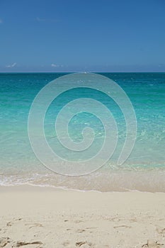 Azure water and blue sky on Grace Bay Beach in the Turks and Caicos