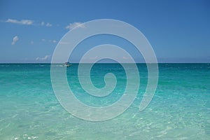 Azure water and blue sky on Grace Bay Beach in the Turks and Caicos