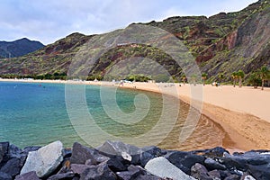 Azure water in a quiet tourist bay with a mountain chain. Illustrating leisure