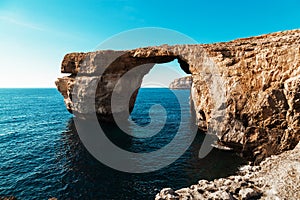 Azure Window, famous stone arch of Gozo island in the sun in summer, Malta