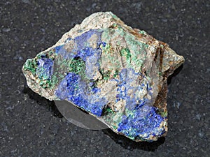 Azurite and Malachite on raw stone on dark