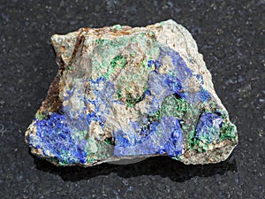 Azurite and Malachite on rough stone on dark