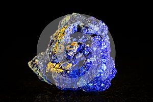 Azurite mineral stone in front of Black photo