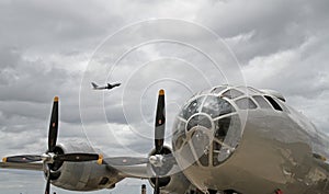 B-29 Bomber with Modern Passenger Jet Overhead
