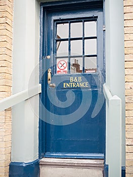 B&b blue door entrance to pub local free house