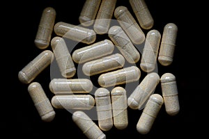 B-complex pills on a dark background, biologically active supplements