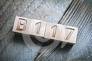 B117 SARS-CoV-2 Mutation Written On Wooden Blocks On A Board photo