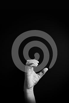 B&W image of hand demonstrating ASL sign language letter C with empty copy space