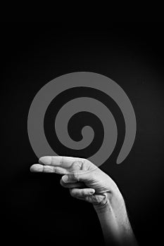 B&W image of hand demonstrating ASL sign language letter H with empty copy space