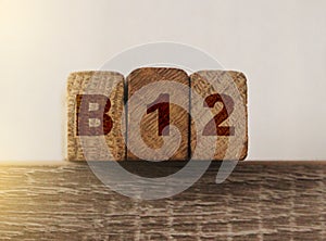 B12 on Wooden Blocks . Vitamin healthcare and healthy living concept