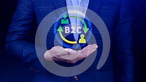 B2C, Business to customer marketing strategy concept. Businessman holding with virtual B2C icon for business strategy,