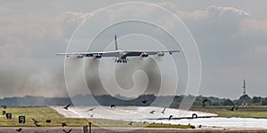 B52 bomber over runway