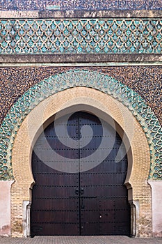 Bab Mansour Gate at El Hedime square, decorated with mosaic ceramic tiles, in Meknes, Morocco