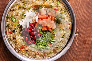 Baba Ganouj with tomato, onion and pomegranate seeds served in dish isolated on background top of arabic food cold mezza photo