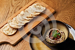 Baba ganoush hummus with eggplant on wooden table background