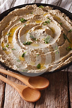 Baba ghanoush eggplant close up on the table. vertical