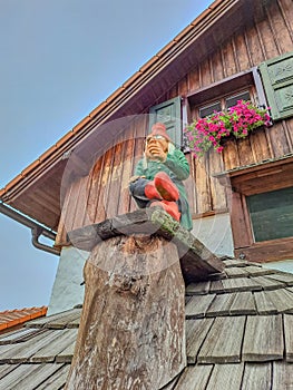 Baba Yaga. Fairy-tale wooden houses with Windows and flowers. Czech