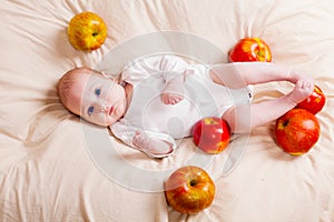Babe lies in apples
