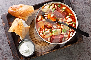 Babgulyas hungarian Soup With Beans, meat and vegetables closeup in the plate. Horizontal top view