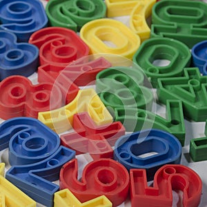 Early Childhood Education , Colorful plastic one to ten number sets in Red, Blue, Green and Yellow colors. in white background.