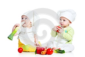 Babies boy and girl wearing a chef