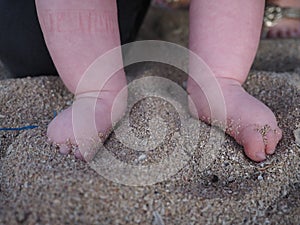 Babies feet in sand, Bali
