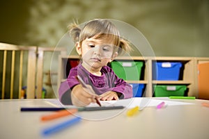 Babies and fun, child drawing at school