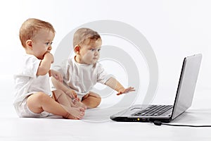 Babies with laptop photo