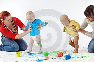 Babies painting with parents