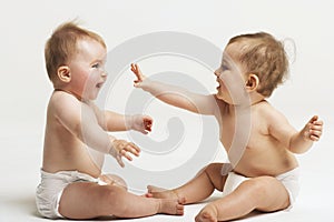 Babies Playing On White Background