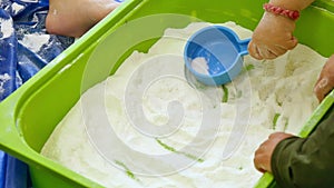 Babies Playing with White Flour in Kindergarten Childcare