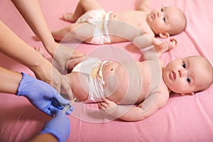 Babies receiving vaccine.