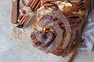 Babka or brioche bread with cinnamon and brown sugar. Homemade pastry for breakfast