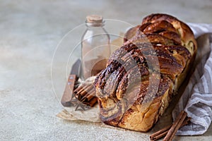 Babka or brioche bread with cinnamon and brown sugar. Homemade pastry for breakfast