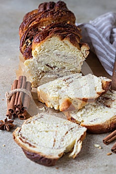 Babka or brioche bread with cinnamon and brown sugar. Homemade pastry for breakfast