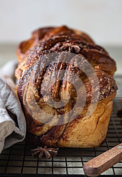 Babka or brioche bread with cinnamon and brown sugar. Homemade pastry for breakfast