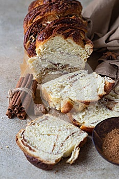 Babka or brioche bread with cinnamon and brown sugar. Homemade pastry for breakfast