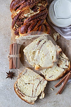 Babka or brioche bread with cinnamon and brown sugar. Homemade pastry for breakfast. Top view