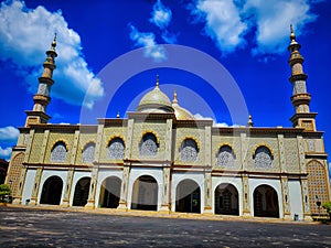 Babul jannah Muslim mosque in Sambas against blue clear sky background photo