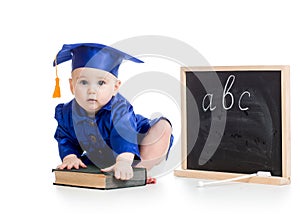 Baby in academician clothes with book