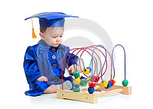 Baby in academician clothes with educational toy