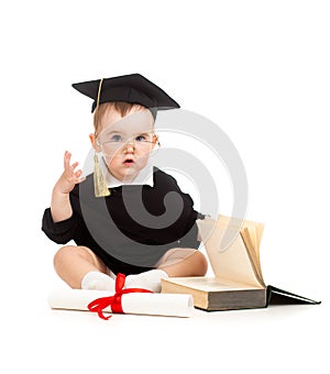 Baby in academician clothes with roll and book