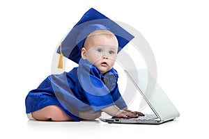 Baby in academician clothes using laptop