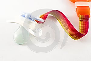 Baby accessories - pacifier with clip holder on white background