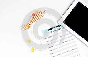 Baby adopting concept with application and tablet top view mock up