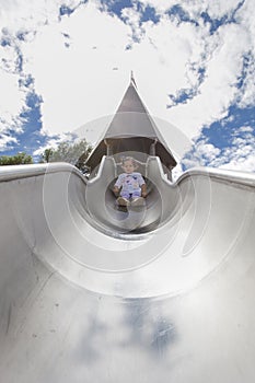 Baby adventurer on huge slide